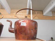 A large Victorian copper kettle.