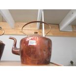 A large Victorian copper kettle.