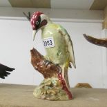 A figure of a Woodpecker (possibly Beswick)