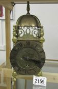 A brass lantern clock.