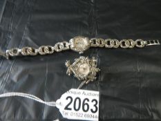 A marcasite watch and small cuckoo watch brooch