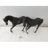 A Royal Doulton horse and a Beswick horse.