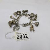 A silver charm bracelet including 4 opening charms, dated Birmingham 1972, approximately 105 grams.