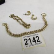 2 yellow metal chains and pair of earrings.