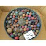 A quantity of old clay marbles etc.