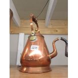 An unusual shaped copper kettle with brass fittings.