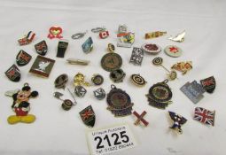 A mixed lot of badges and medallions.