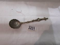 A decorative spoon with figure finial.