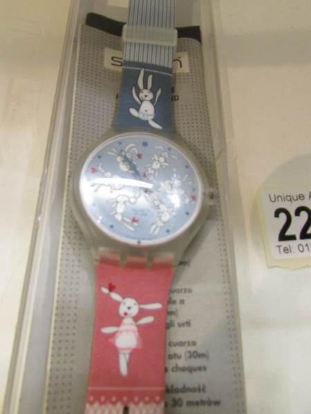 A Gentleman's Swatch wrist watch depicting rabbits.