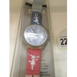 A Gentleman's Swatch wrist watch depicting rabbits.