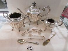 A 3 piece silver plate tea set (made in Sheffield), sugar nips etc.