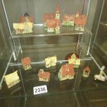 12 miniature cottages, a wishing well and a village pump.