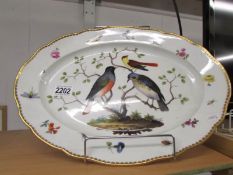 A Meissen meat platter decorated with birds.