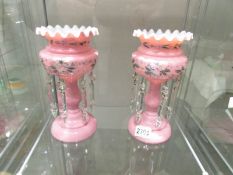 A pair of Victorian pink glass lustres.