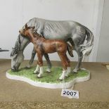 A Goebel group figure of a Horse and Foal, stamped to underside 3231318, 1974.