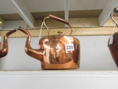 A Victorian oval copper kettle.