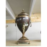 A Victorian copper samovar with brass tap.