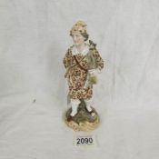 A 19th century continental porcelain figurine.