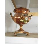 A Victorian copper samovar with brass tap.