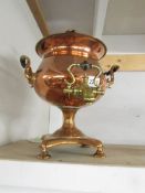 A Victorian copper samovar with brass tap.