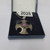 A Scottish Celtic millifiori set pendant in a silver shield design, maker C.J.