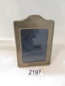 A small silver photograph frame.