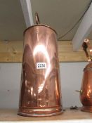 A tall Victorian copper container.