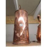 A tall Victorian copper container.