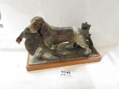 An Austrian cold painted bronze touch tip lighter of a spaniel holding a pheasant.
