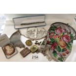 A mixed lot including evening hand bags, costume jewellery, record needle tins,