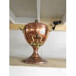 A Victorian copper samovar with brass tap.