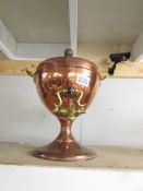 A Victorian copper samovar with brass tap.