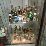 Approximately 30 wine and spirit miniature bottles, some with contents (2 shelves).