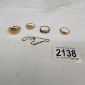 Approximately 12 grams of 9ct scrap gold (4 rings and small piece of chain).