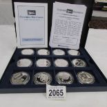 A cased 'Concorde Milestones' mint set coin collection of 12 silver £5 coins