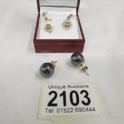 A pair of 9ct gold ear pendants together with a pair fo nematite stud earrings.