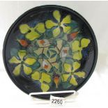 A Moorcroft Hypericum pattern plate, approximately 10.