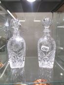 A pair of superb quality cut glass decanters.