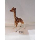 A Beswick graffe in good condition.