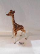 A Beswick graffe in good condition.