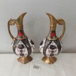 A pair of Royal Crown Derby ewer's.