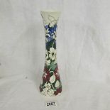 A Moorcroft polenator vase, approximately 30 cm tall, (second quality).