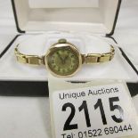 A 9ct gold ladies wrist watch with expanding strap, circa 1940's.