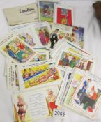 Approximately 80 vintage humorous seaside postcards.