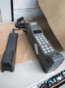 A Vodaphone portable / car brick phone with charger