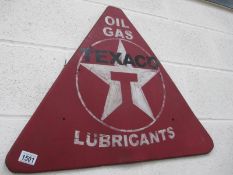 A triangular Texaco oil, gas, lubricants metal sign.