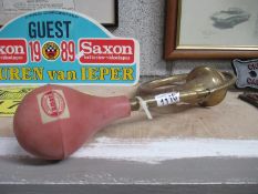 A brass car horn