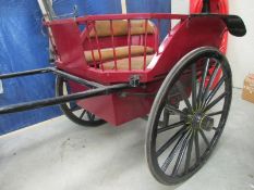 A good 4 seat single horse buggy in original livery.