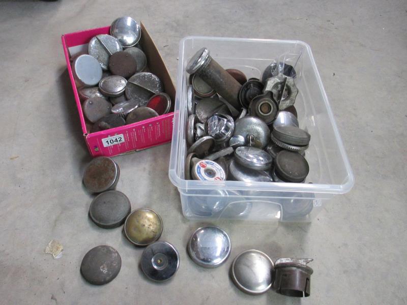 2 boxes of radiator and rocker cover caps and a collection of vintage chrome