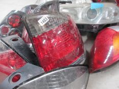 A huge lot of Ford/Vauxhall etc., front headlamp and rear lamp assemblies.